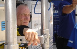 Mark Martin watches and listens as the car is on track during the Thursday Test day at Iowa