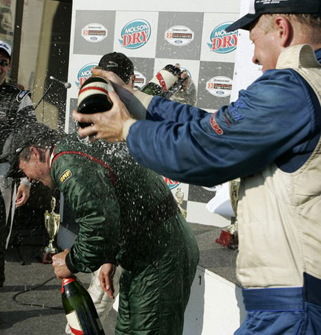 Randy showers Graf with champgne on Montreal podium